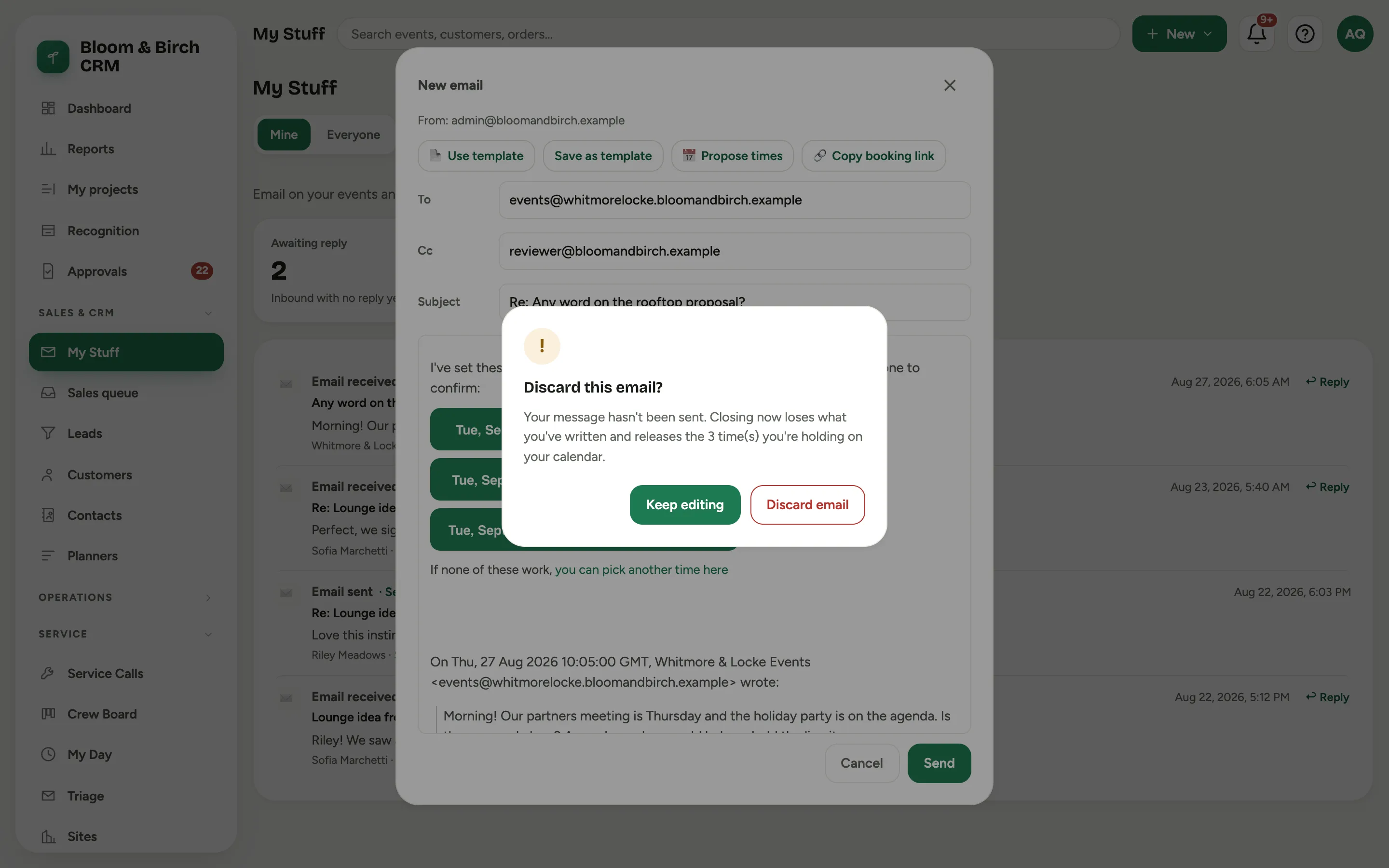 The Discard this email question over the composer, saying the message has not been sent and that closing releases the times being held on the calendar, with Keep editing and Discard email