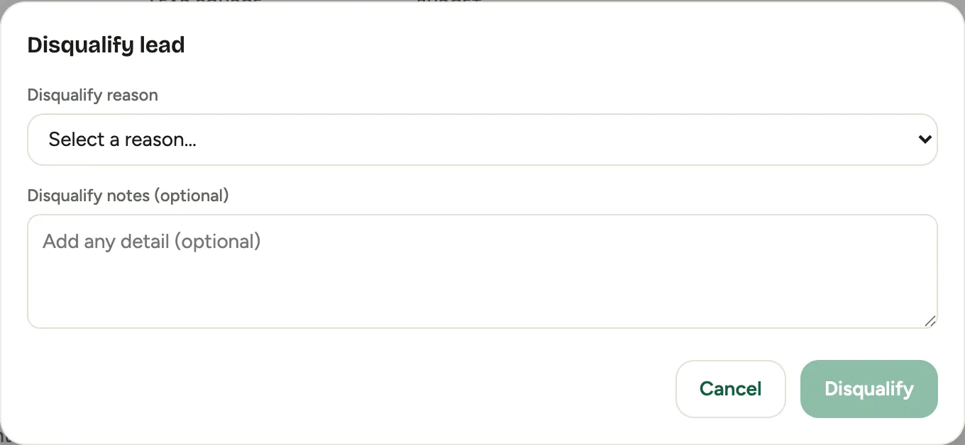 The Disqualify lead dialog: a reason dropdown and an optional note field